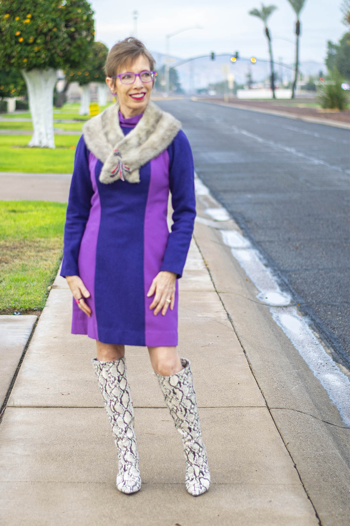 Dress with over-the-knee snake print boots