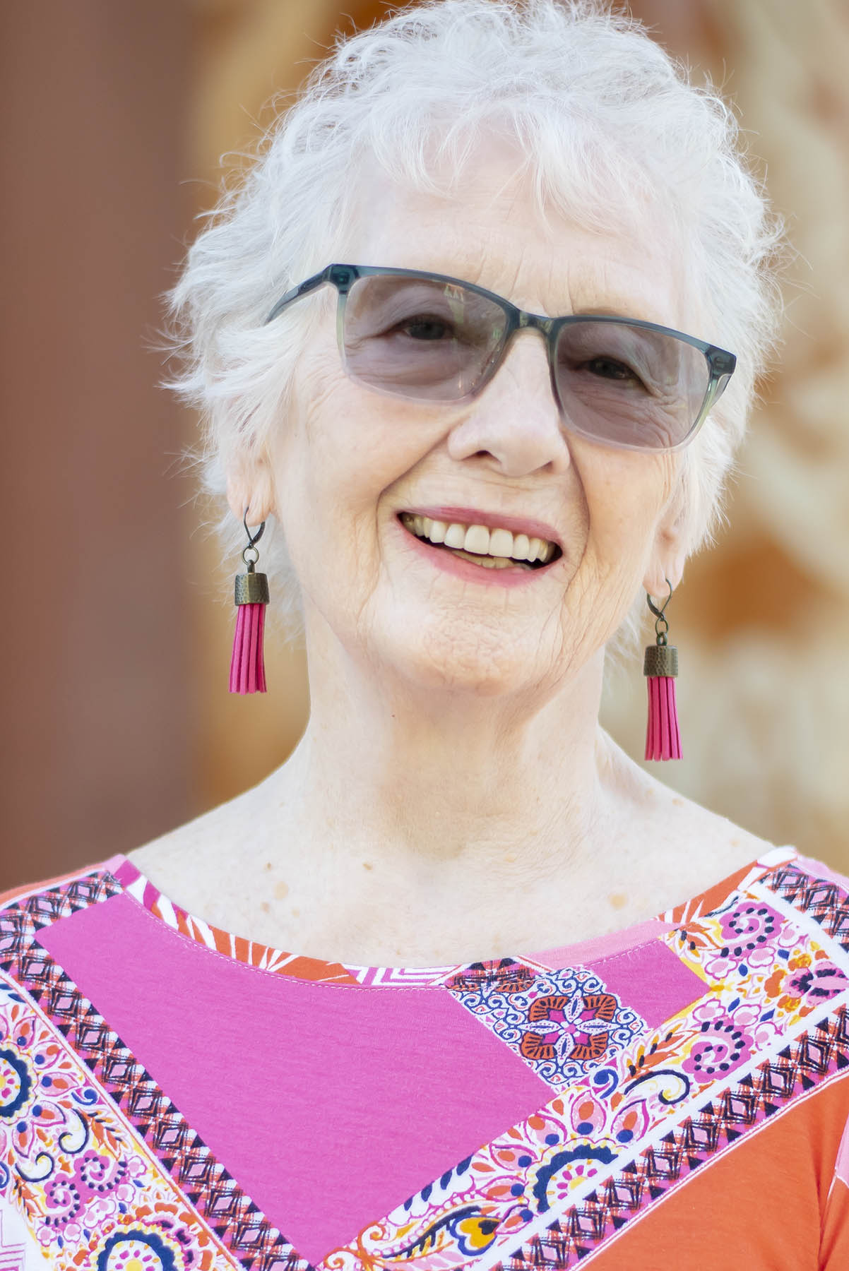 Woman over 80 with fringe earrings
